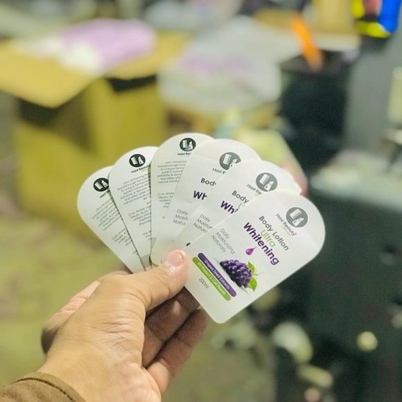 Self-adhesive label for body lotion bottle with matte lamination, spot UV highlights, and premium shape cutting for luxury skincare packaging